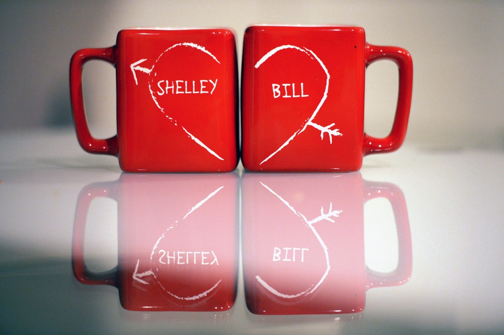 Two red mugs read "Shelley and Bill" with a heart