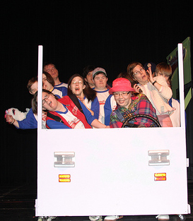 Group of actors in a cardboard bus