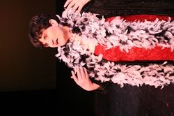Actors wearing a feather boa