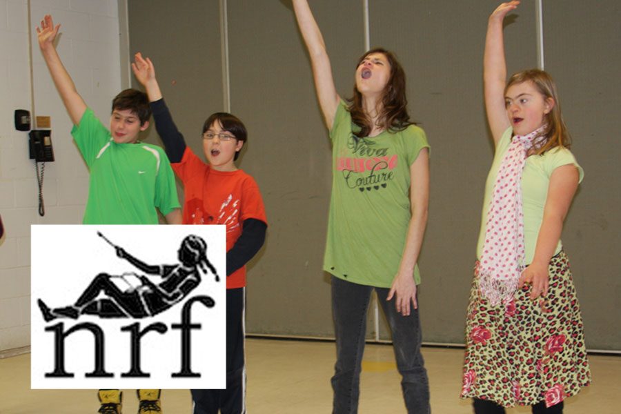 Kids throw their hands in the air, singing, with the Nora Roberts Foundation logo in the corner
