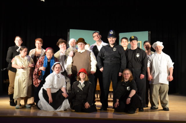 Group shot of actors on stage after a show.