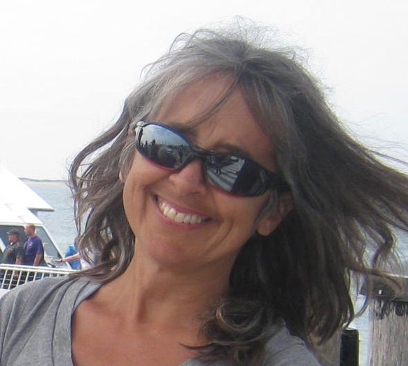 Headshot of Wendy Lanxer smiling and wearing sunglasses
